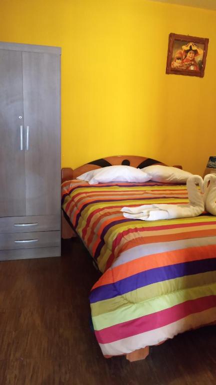 Postel nebo postele na pokoji v ubytování Casa Salkantay Cusco
