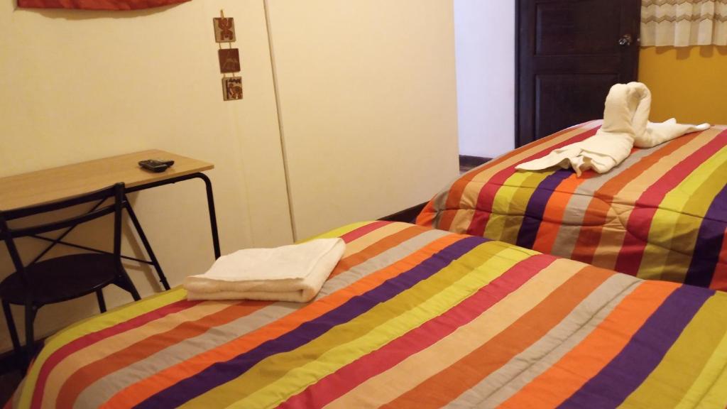 Postel nebo postele na pokoji v ubytování Casa Salkantay Cusco