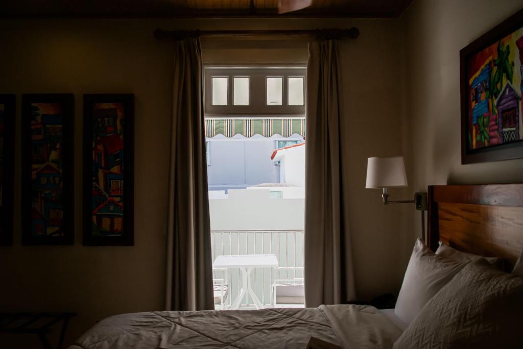 Postel nebo postele na pokoji v ubytování Casa Wilson Inn