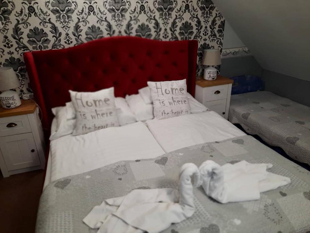 Postel nebo postele na pokoji v ubytování Kék Lagúna Wellness Apartmanok