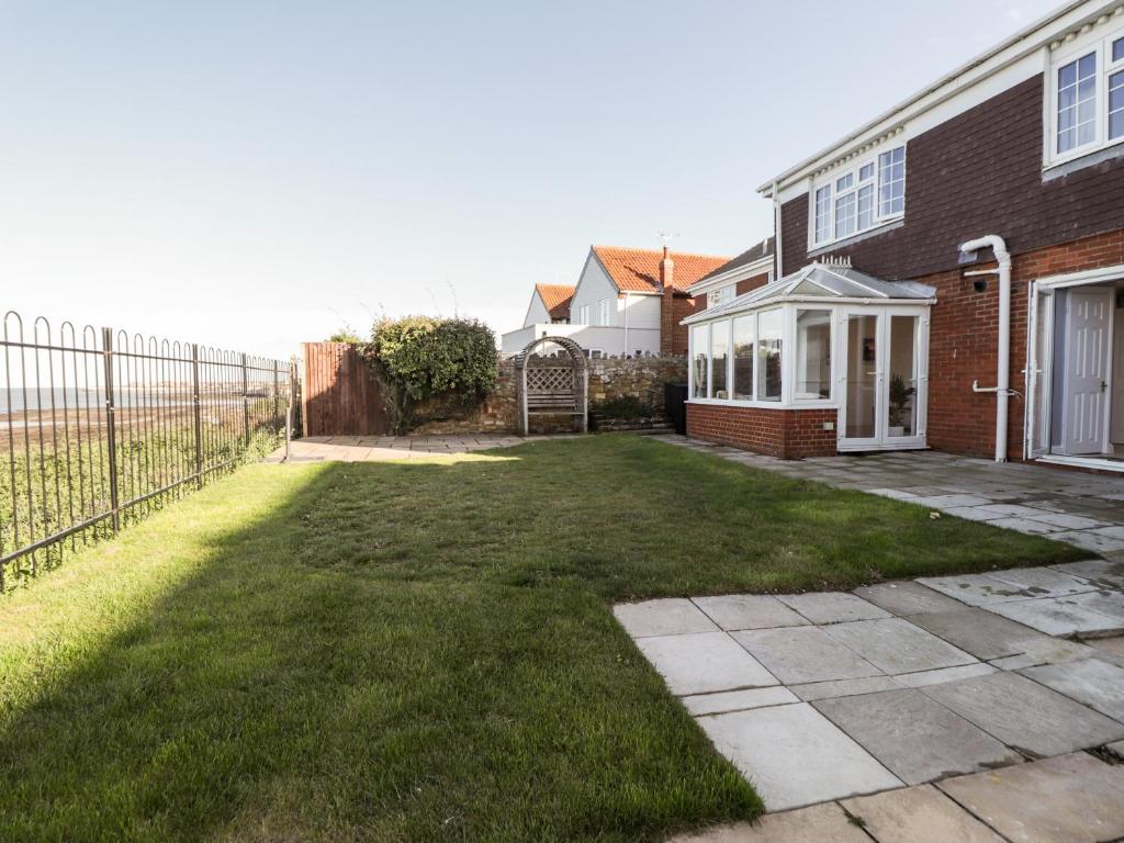 a backyard of a house with a fence at 17 St Magnus Close in Birchington