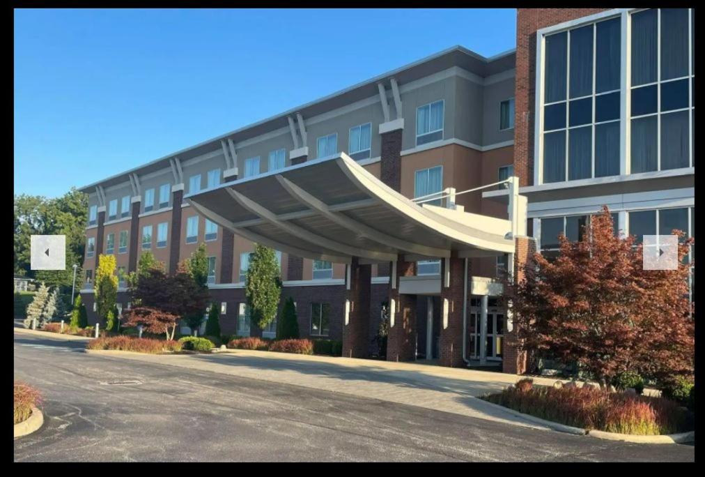 a large building with a large awning in front of it at Wyndham Avon in Avon Center