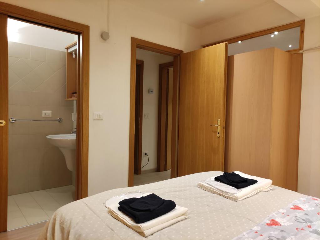 Postel nebo postele na pokoji v ubytování Doss della Pesa Apartment