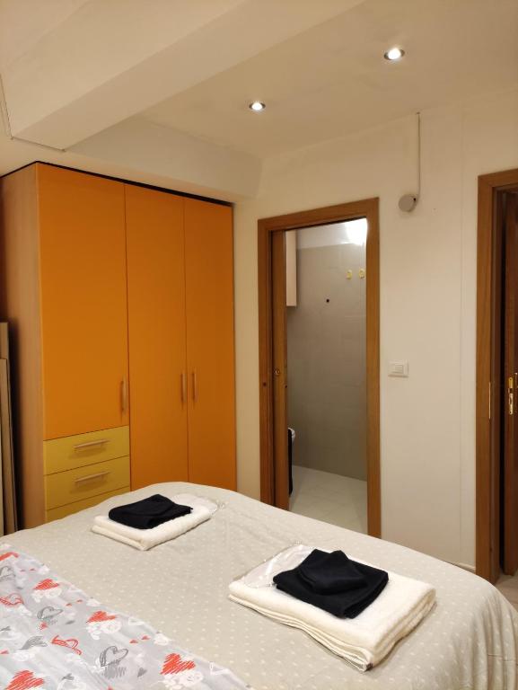 Postel nebo postele na pokoji v ubytování Doss della Pesa Apartment