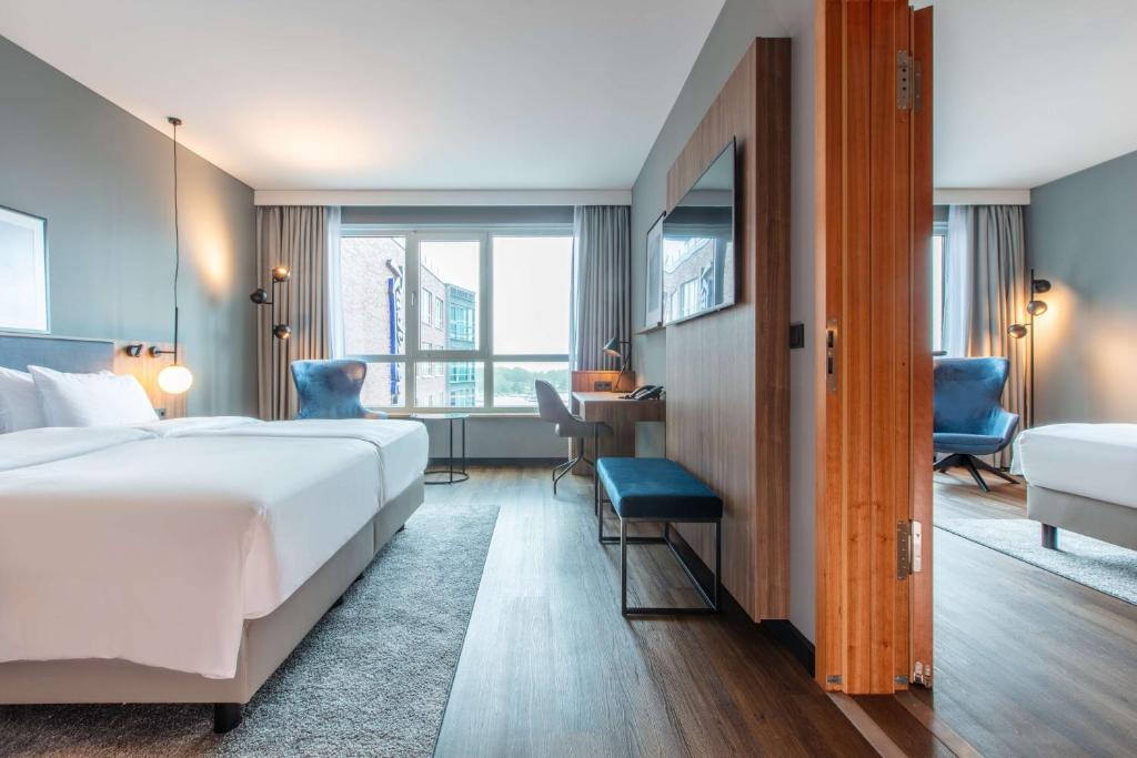 Postel nebo postele na pokoji v ubytování Radisson Blu Hotel Rostock