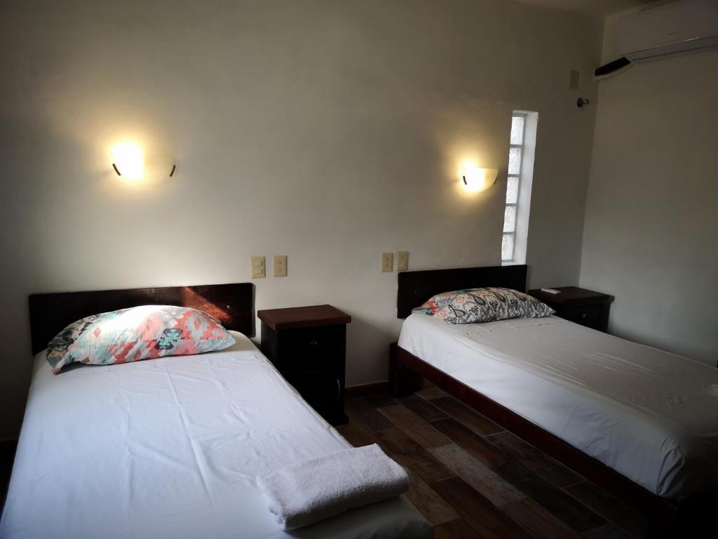 Postel nebo postele na pokoji v ubytování Xcalak Caribe Lodge