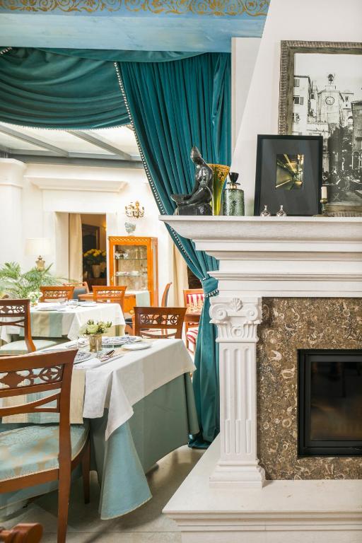 Reštaurácia alebo iné gastronomické zariadenie v ubytovaní Judita Palace Heritage Hotel