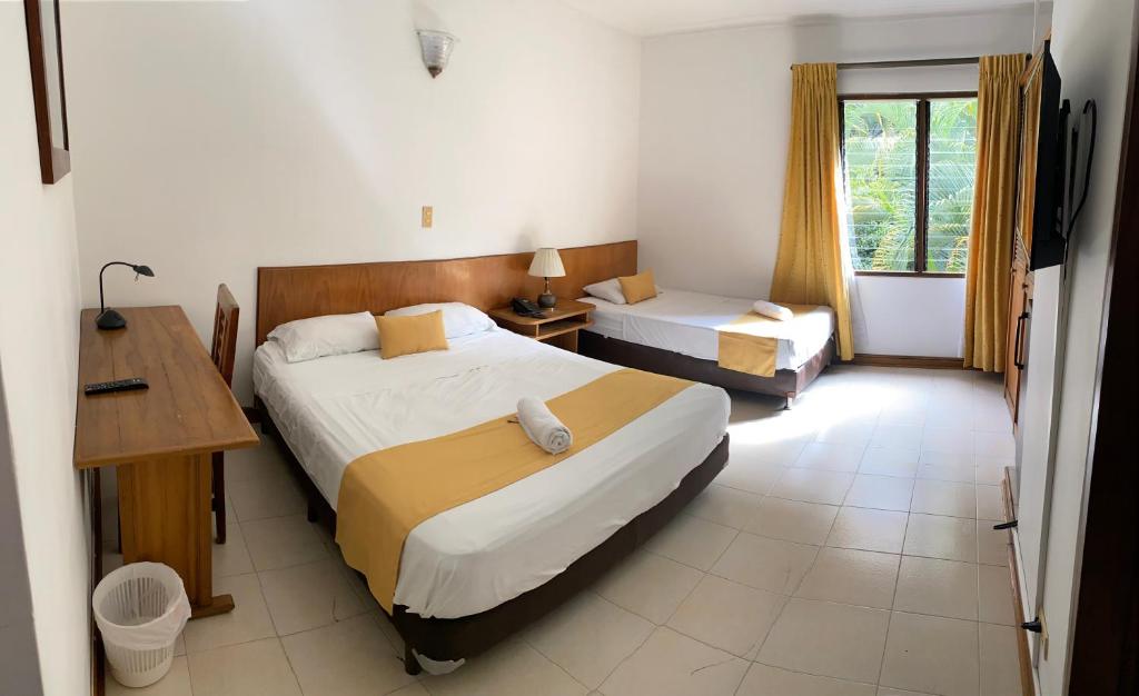 Postel nebo postele na pokoji v ubytování Casa Rosales