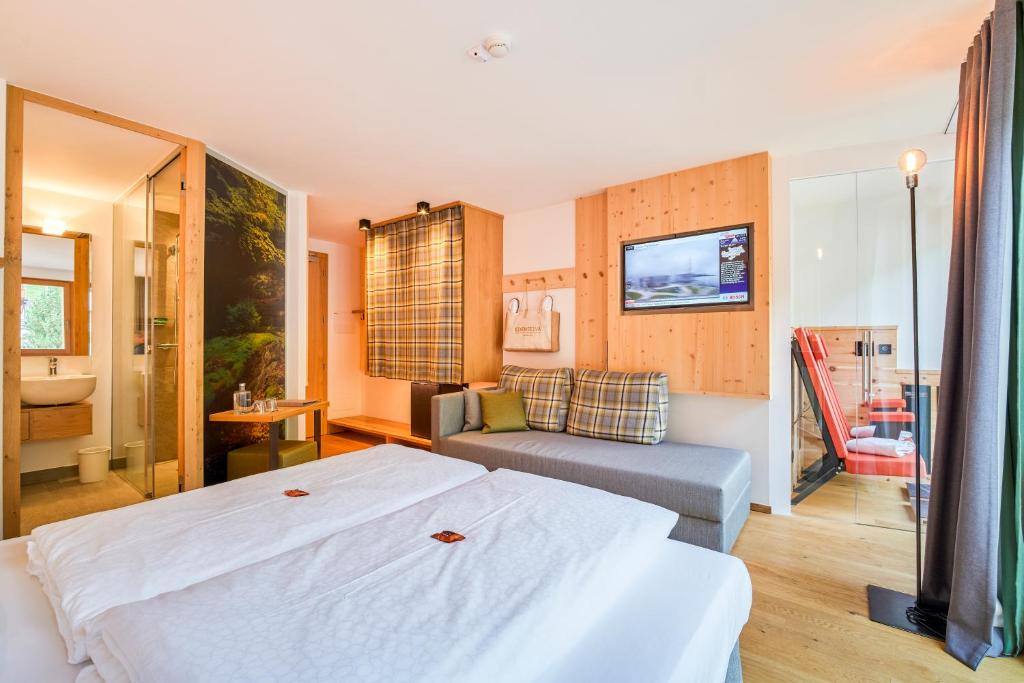 Postel nebo postele na pokoji v ubytování Mountain Design Hotel EdenSelva