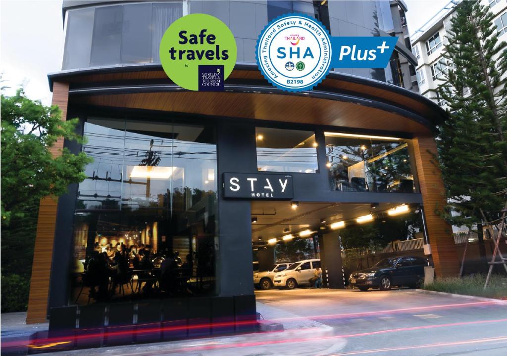a store front with a sign that says skip travels skip plus at STAY Hotel BKK - SHA PLUS in Bangkok