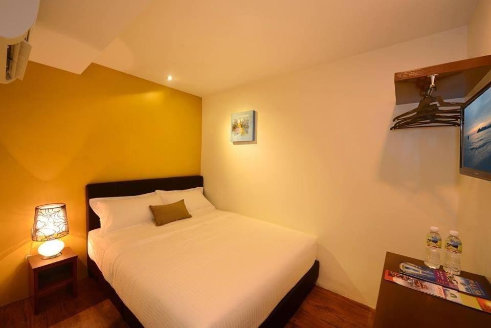 Voodi või voodid majutusasutuse Season Inn Langkawi Motel toas
