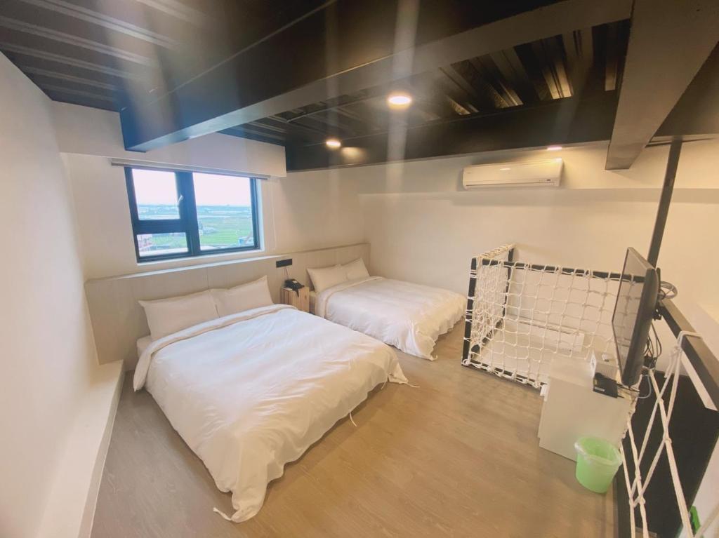 Postel nebo postele na pokoji v ubytování Love Tong