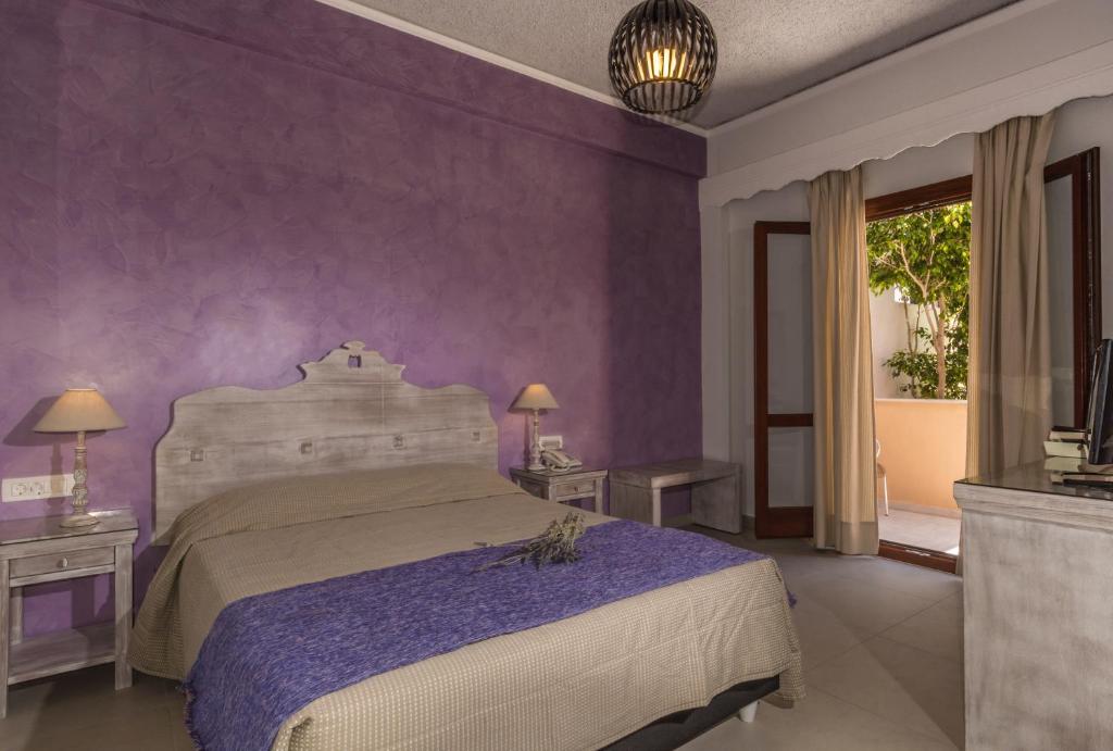Postel nebo postele na pokoji v ubytování Hotel Sunrise