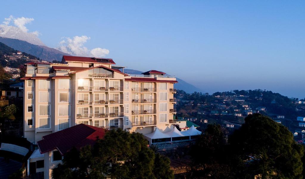 a large building on top of a mountain at Best Western Plus Revanta Mcleod Ganj in Dharamshala