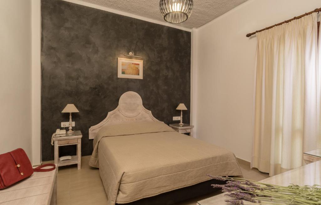Postel nebo postele na pokoji v ubytování Hotel Sunrise