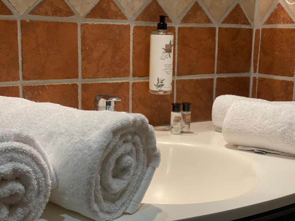 Postel nebo postele na pokoji v ubytování Hotel L'Edelweiss