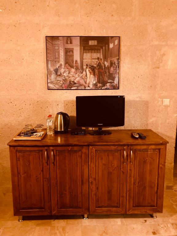 TV a/nebo společenská místnost v ubytování Monte Cappa Cave House