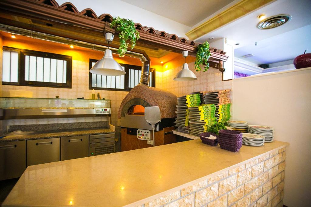 Kuchyň nebo kuchyňský kout v ubytování Hotel Agli Olmi