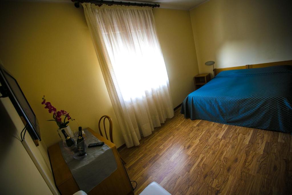 Postel nebo postele na pokoji v ubytování Hotel Agli Olmi