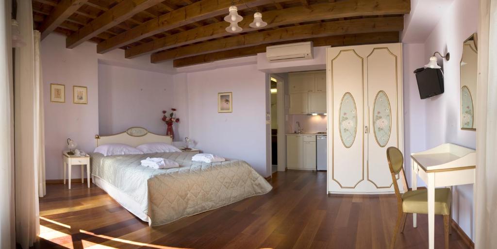 Postel nebo postele na pokoji v ubytování Palazzo Duca