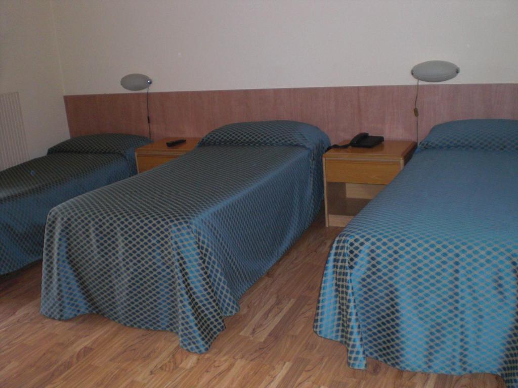 Postel nebo postele na pokoji v ubytování Hotel Agli Olmi