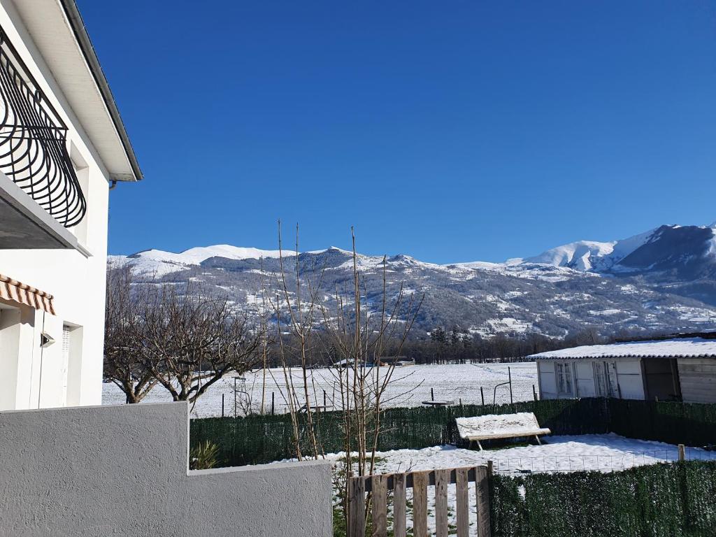 a view of a snowy mountain from a house at appartement Isabelle in Lau-Balagnas