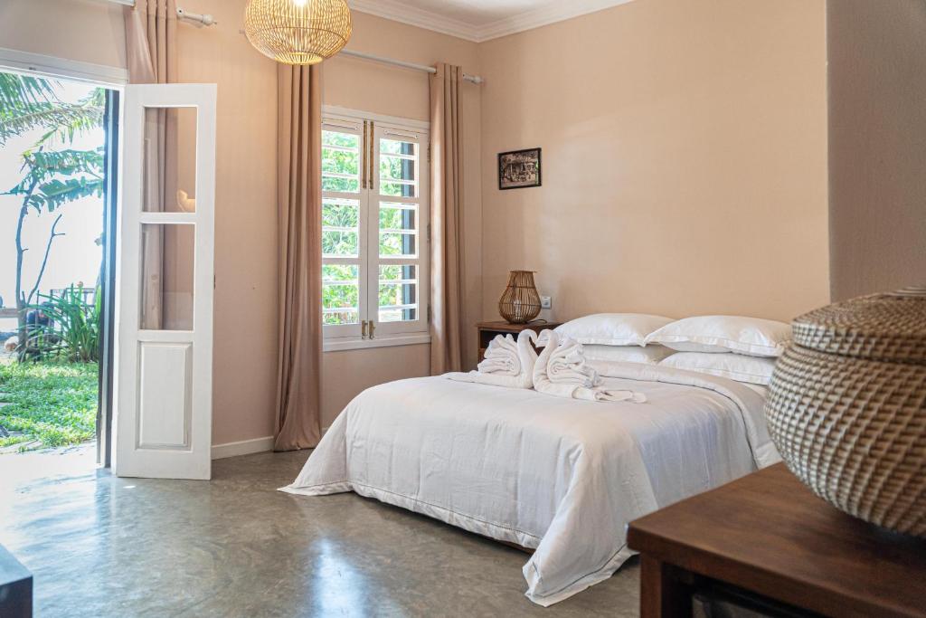 Postel nebo postele na pokoji v ubytování THE SLOW vegan hotel