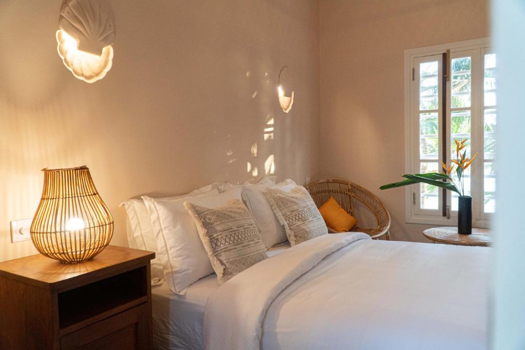 Postel nebo postele na pokoji v ubytování THE SLOW vegan hotel