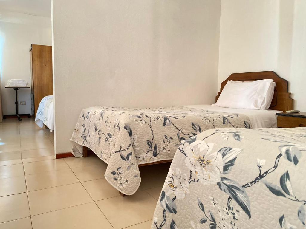 Postel nebo postele na pokoji v ubytování Hotel Vidal