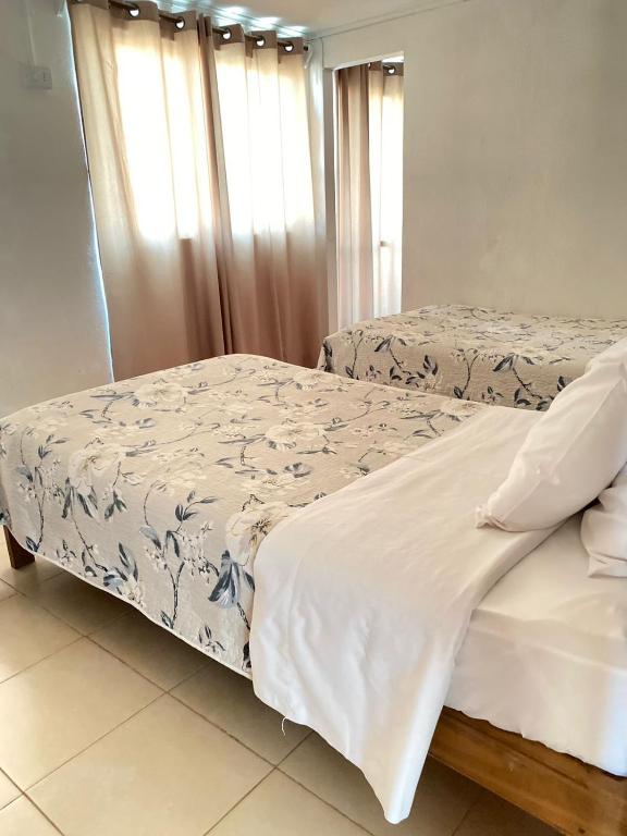 Postel nebo postele na pokoji v ubytování Hotel Vidal