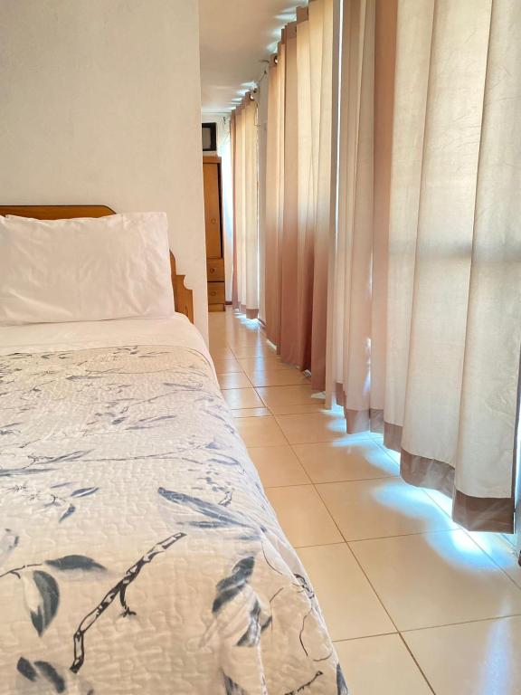 Postel nebo postele na pokoji v ubytování Hotel Vidal