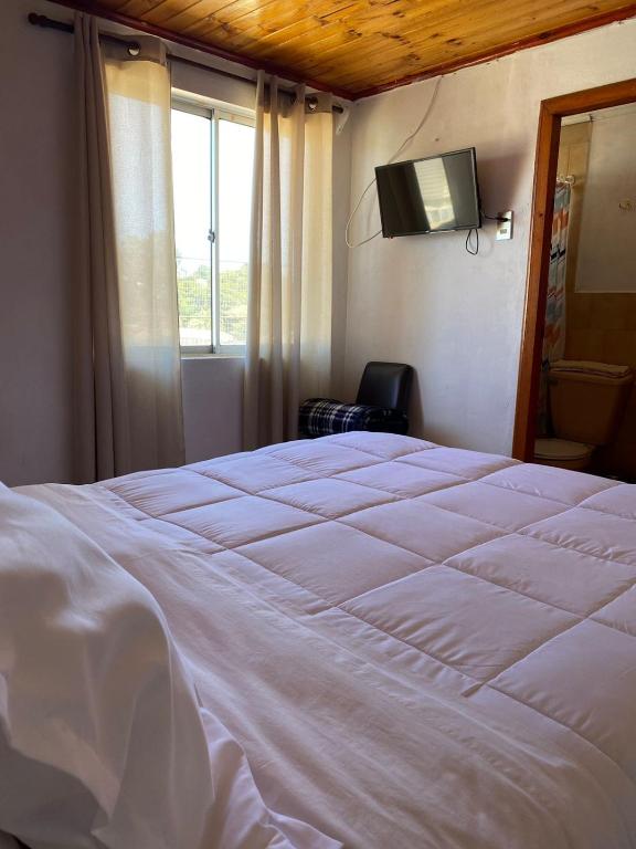 Postel nebo postele na pokoji v ubytování Hotel Vidal