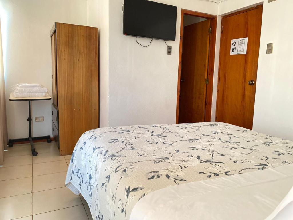 Postel nebo postele na pokoji v ubytování Hotel Vidal