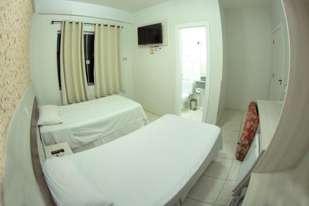 Postel nebo postele na pokoji v ubytování Hotel Sambakia