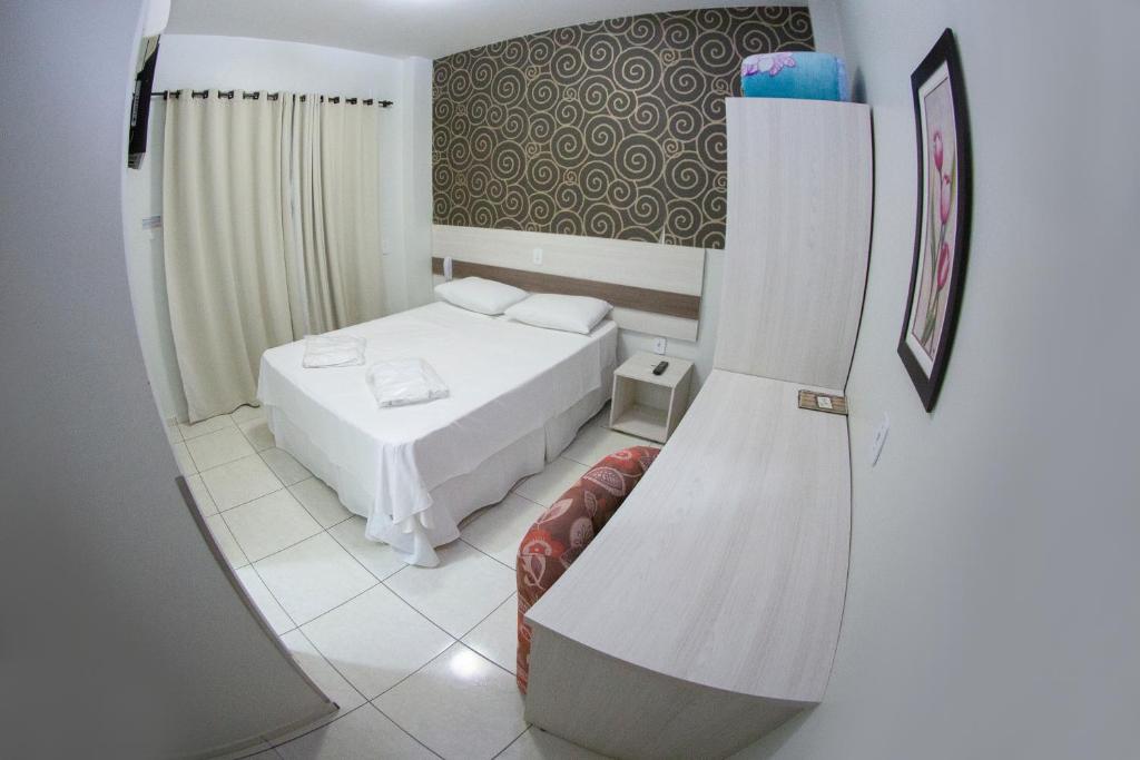 Postel nebo postele na pokoji v ubytování Hotel Sambakia
