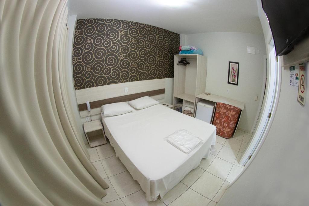 Postel nebo postele na pokoji v ubytování Hotel Sambakia
