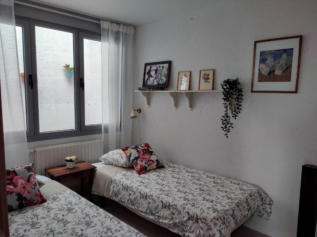 Postel nebo postele na pokoji v ubytování Casa de Babel