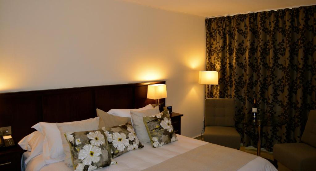 Postel nebo postele na pokoji v ubytování New Brookfields Hotel