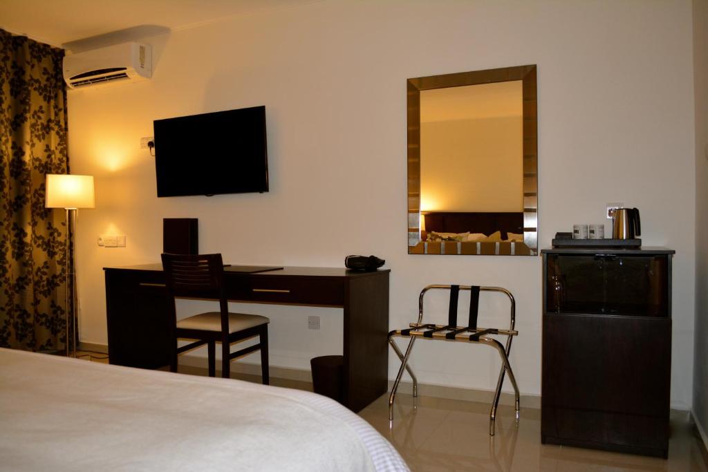 Postel nebo postele na pokoji v ubytování New Brookfields Hotel