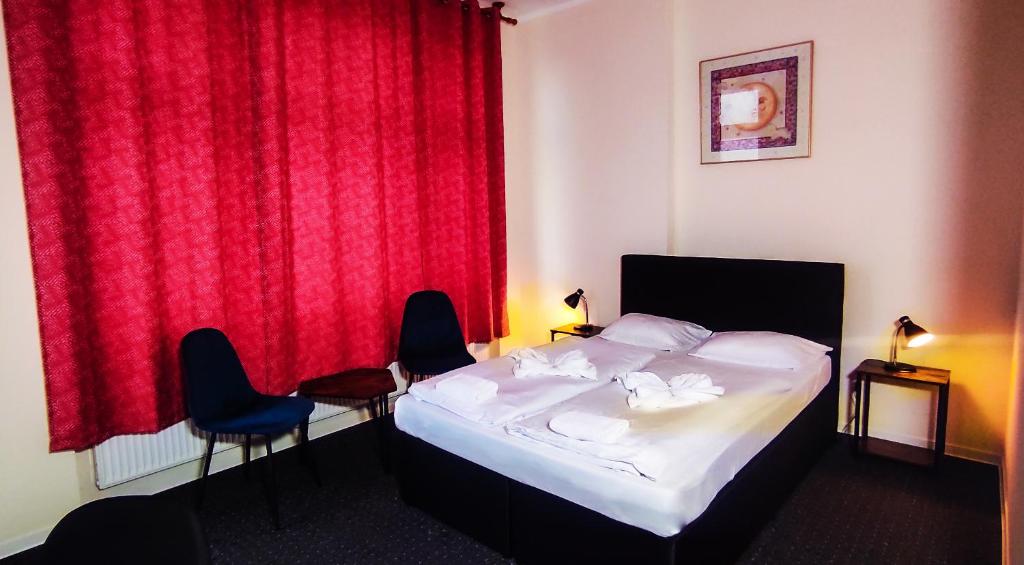 Postel nebo postele na pokoji v ubytování Hotel Karlshorst