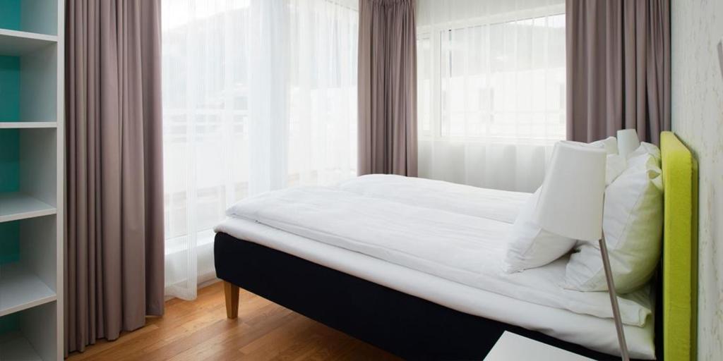 Postel nebo postele na pokoji v ubytování Thon Hotel Sandven