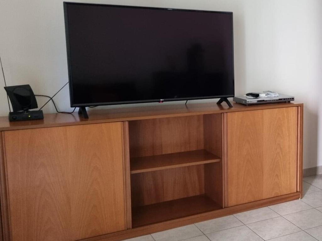 Telewizja i/lub zestaw kina domowego w obiekcie COCO Apartments