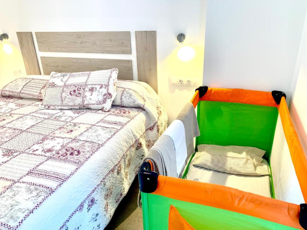 A bed or beds in a room at Edifici Valeria