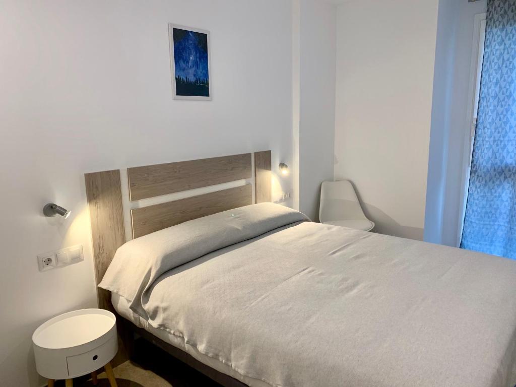 A bed or beds in a room at Edifici Valeria