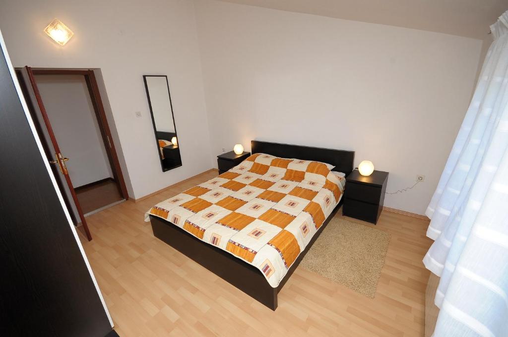 Łóżko lub łóżka w pokoju w obiekcie Apartament VV