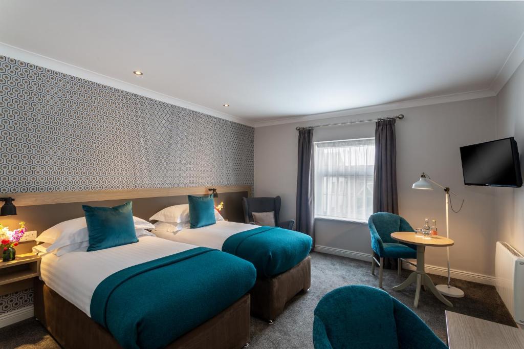 Voodi või voodid majutusasutuse The Ashe Hotel toas