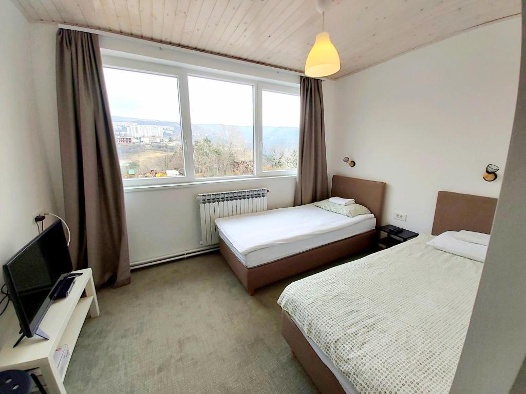 Postel nebo postele na pokoji v ubytování Hostel Dharma