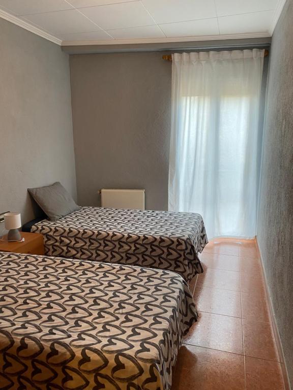 מיטה או מיטות בחדר ב-Habitatge d'ús turístic Lo Cresol