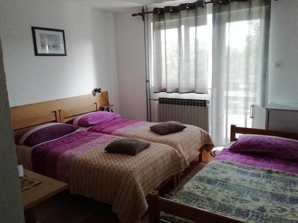 Postel nebo postele na pokoji v ubytování Guest House Raukar