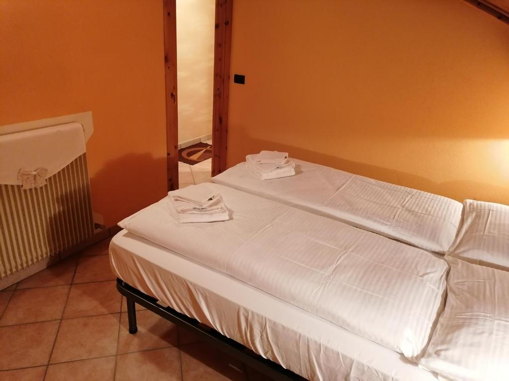 Łóżko lub łóżka w pokoju w obiekcie Wood Apartments